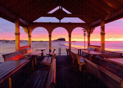 1000-piece Nobbys Pavilion Newcastle jigsaw puzzle featuring a colourful sunrise over Nobbys Beach and Nobbys Lighthouse