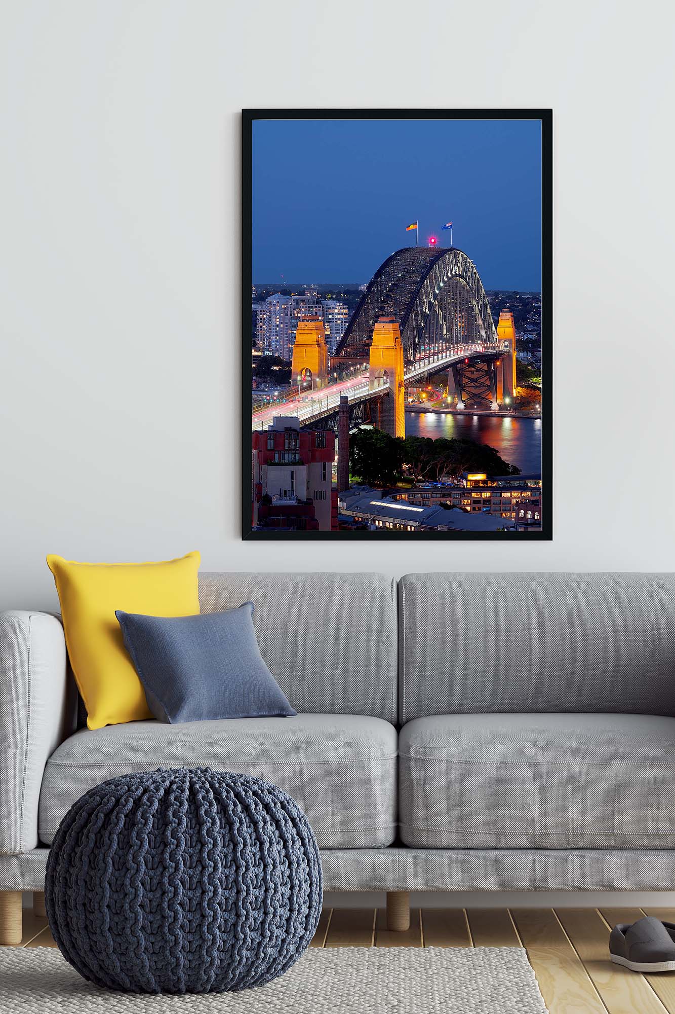 Framed photograph of the Sydney Harbour Bridge in blue dusk tones displayed as modern coastal wall art.