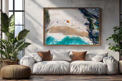 Framed aerial photograph of Tamarama Beach displayed as modern coastal wall art in a contemporary interior.