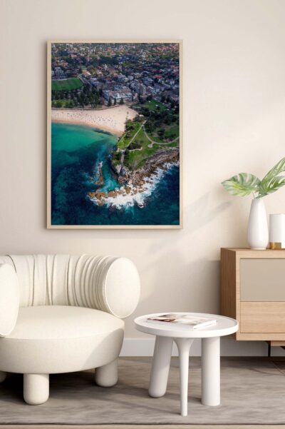 Framed aerial print of Coogee Beach and its prominent headland styled as contemporary coastal artwork.