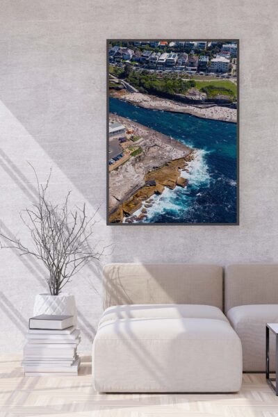 Framed aerial photograph highlighting the rock platform at Clovelly Beach displayed as modern coastal wall art