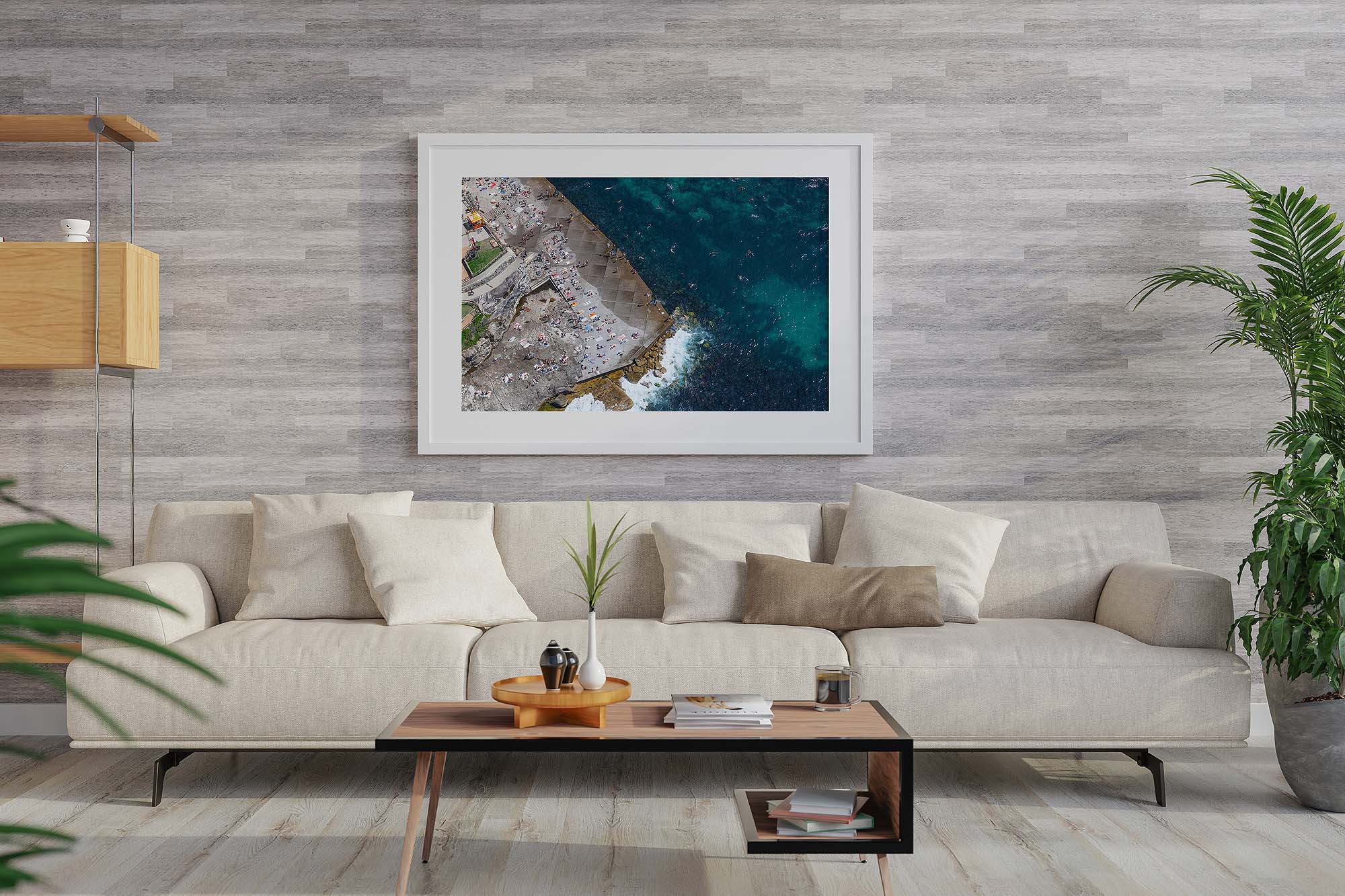 Framed aerial photograph highlighting the rock formations at Clovelly Beach displayed as modern coastal wall art.