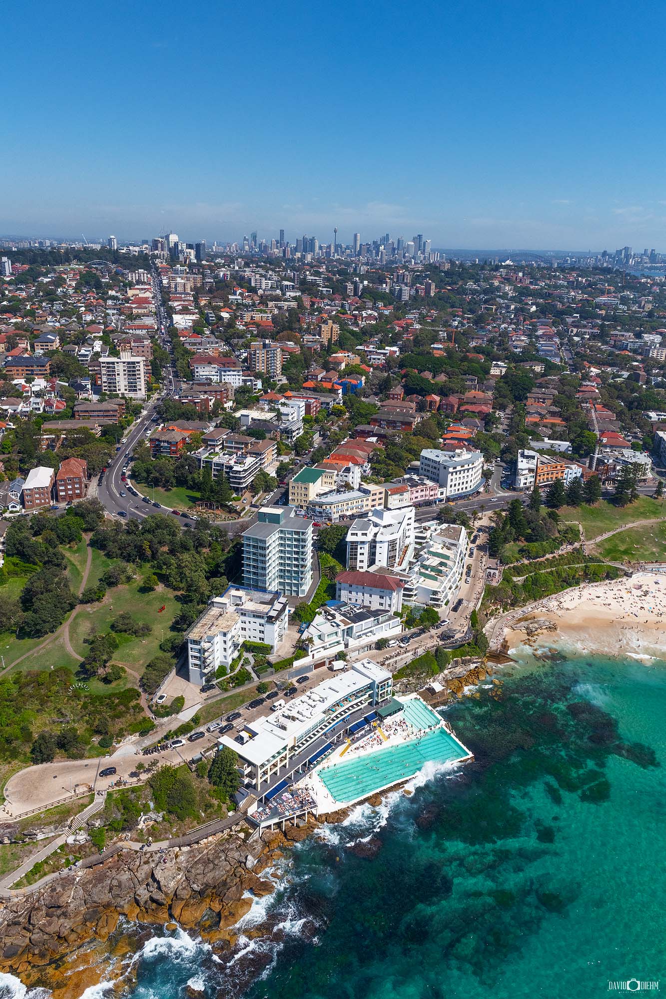 Aerial photograph of Bondi Icebergs swimming pool and clubhouse overlooking Bondi Beach in Sydney, captured from above.