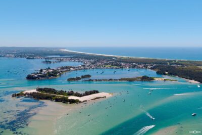 Aerial photography of Lake Macquarie showing sand islands and coastal waters in summer conditions