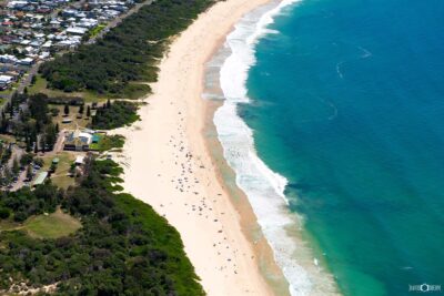 Blacksmiths Beach in Lake Macquarie captured from the air on a summer day showing coastline and ocean conditions