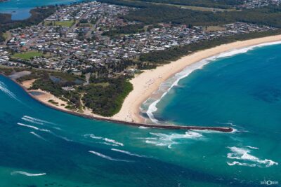 Aerial view of Blacksmiths Beach and Swansea Channel entrance with breakwall in Lake Macquarie NSW