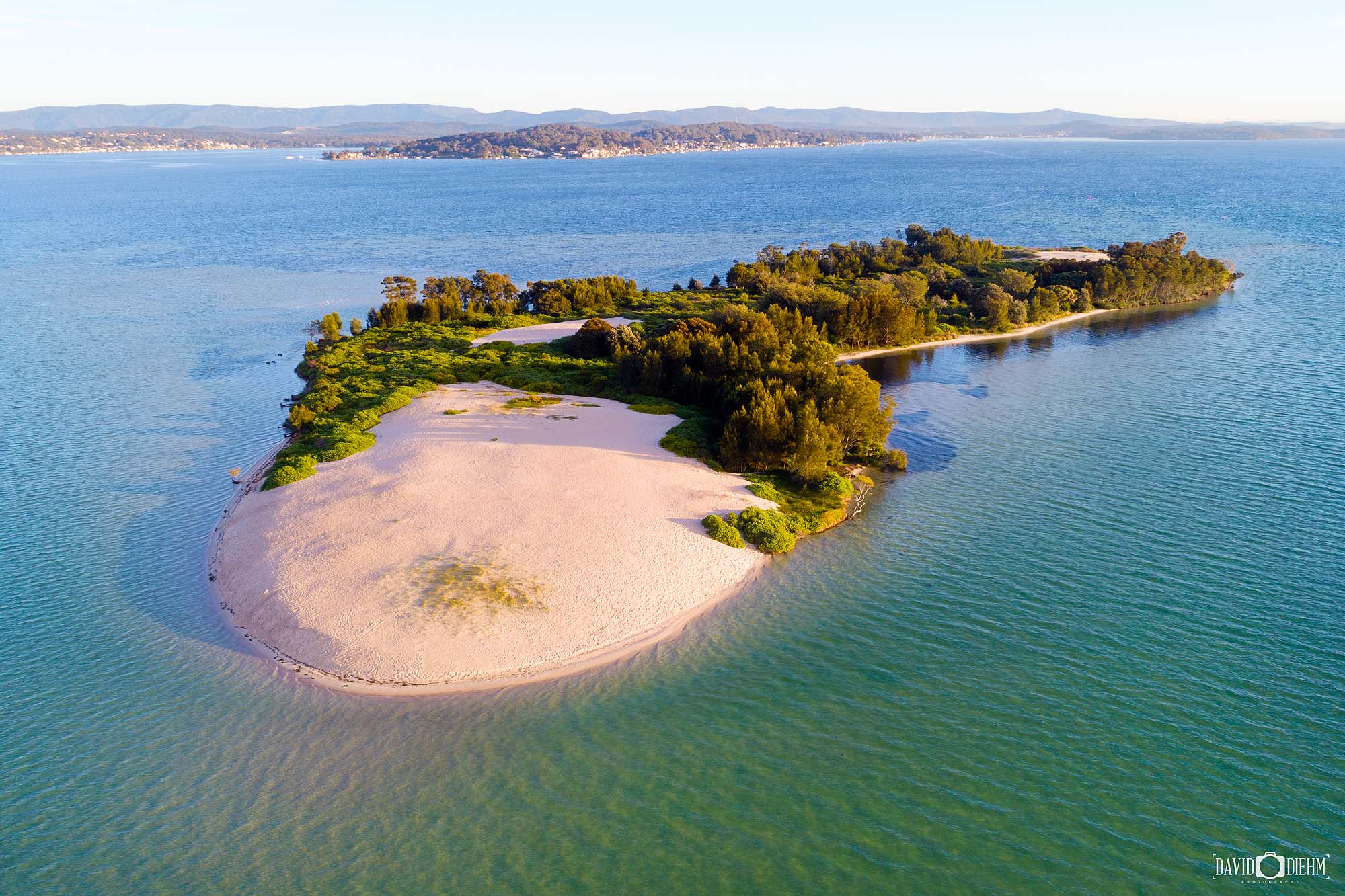 Elizabeth Island at Swansea in morning light with turquoise waters and sandy shores in Lake Macquarie NSW