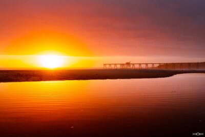 Sunrise at Catherine Hill Bay with jetty reflected in still water, Lake Macquarie NSW