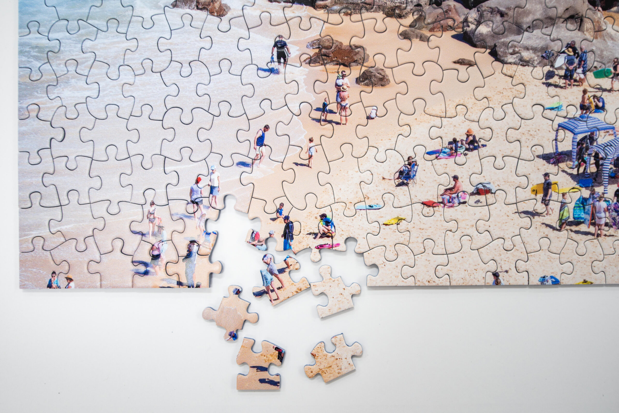 Close-up of a Newcastle jigsaw puzzle piece featuring coastal and Lake Macquarie photography