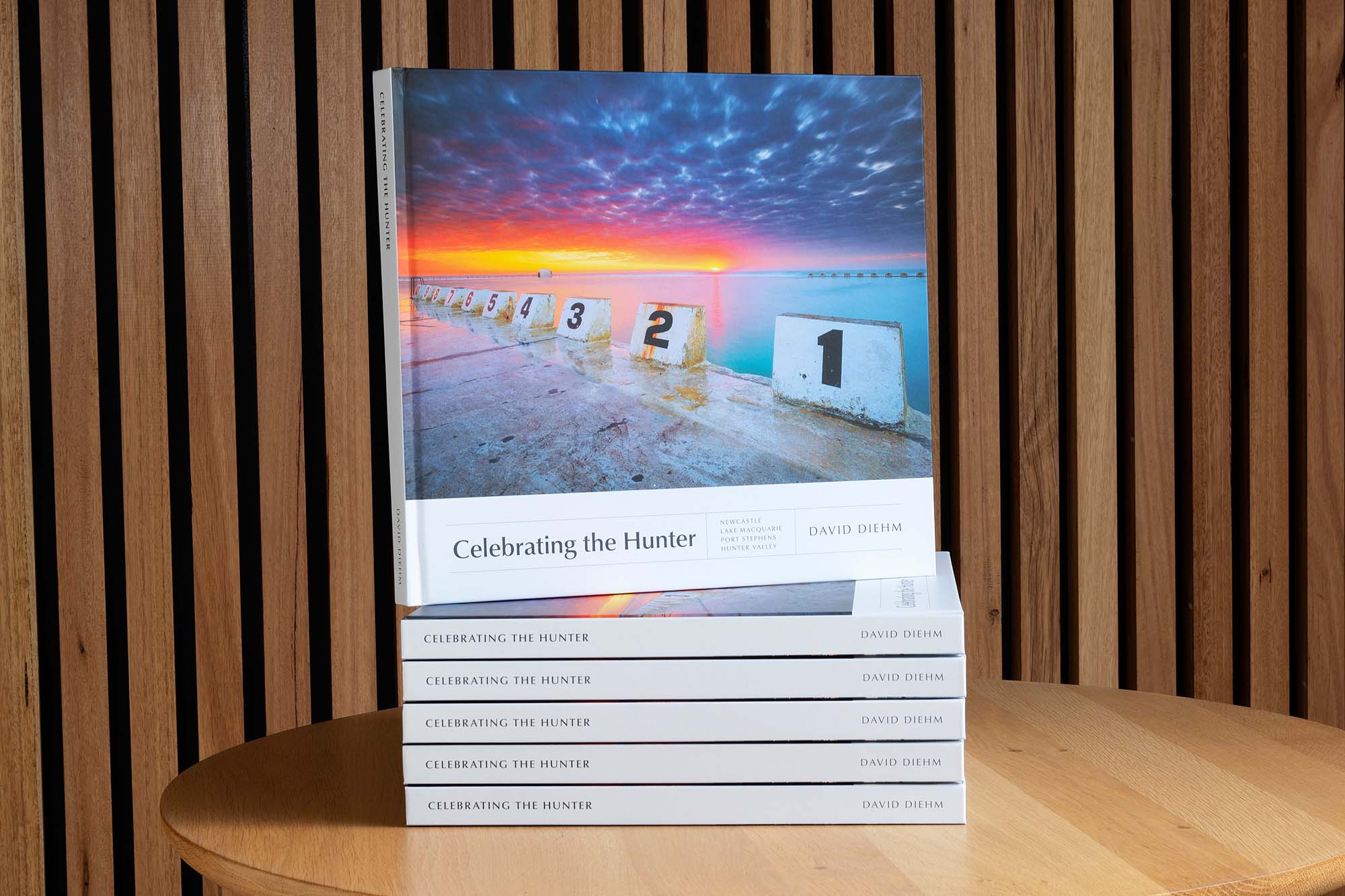 Celebrating the Hunter photography book featuring a collection of landscape photographs showcasing the Hunter region’s coastlines, countryside, and iconic scenery in New South Wales.