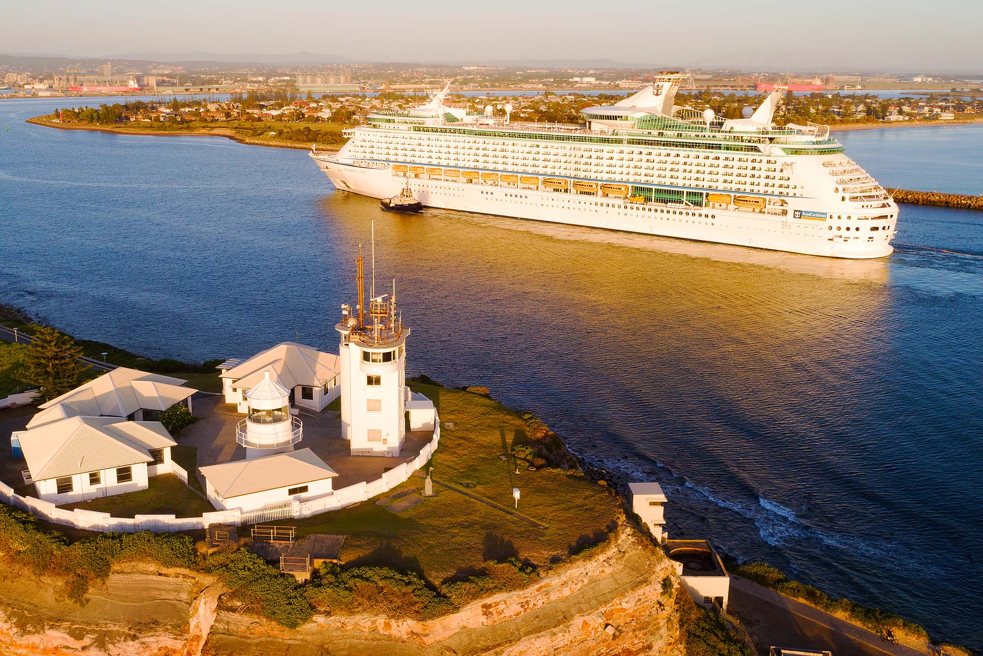 Aerial view of cruise ship entering Newcastle Harbour on a clear day for tourism and commercial use