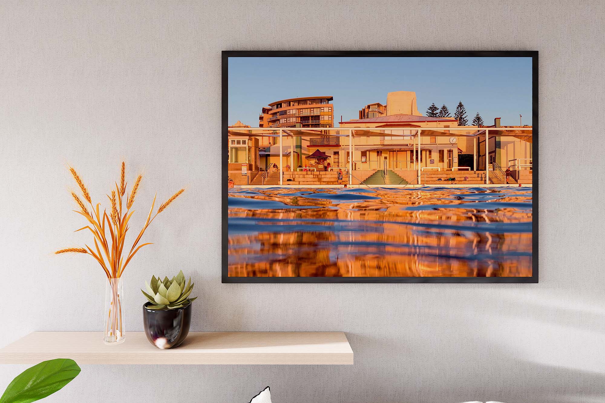 newcastle-ocean-baths-sunrise-light-reflection.jpg Newcastle Ocean Baths sunrise with golden light reflections on calm water