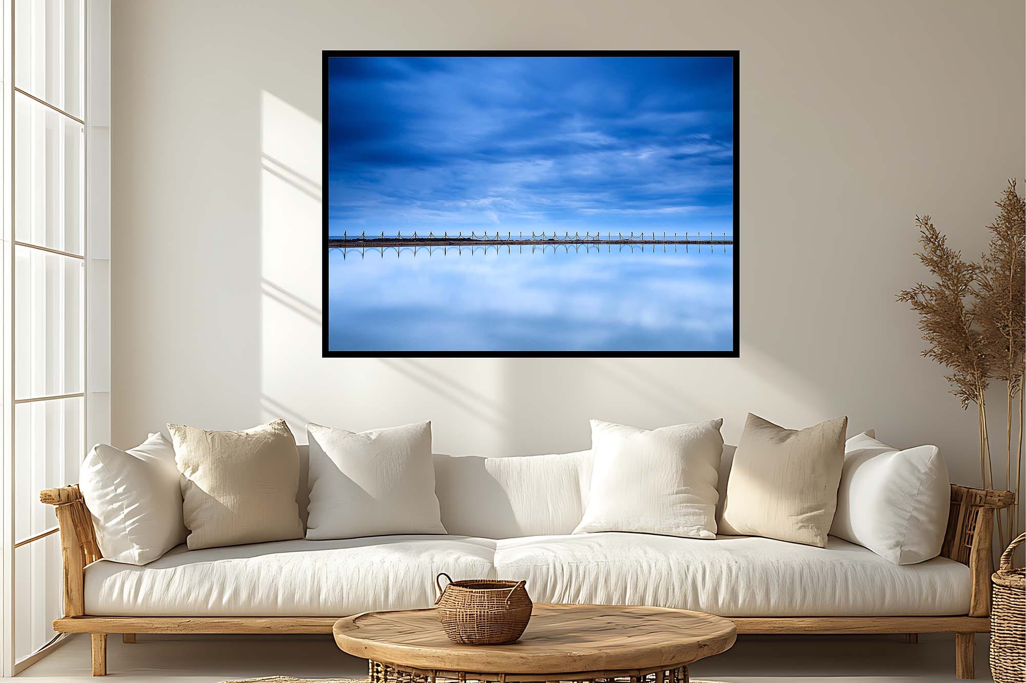 Modern living room with proportionally sized wall art above sofa illustrating how to choose wall art size for your space