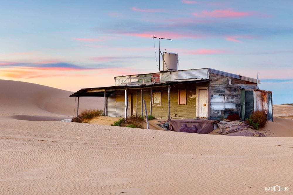 Historic Tin City fishing shack surrounded by the Stockton Sand Dunes on Stockton Beach near Newcastle