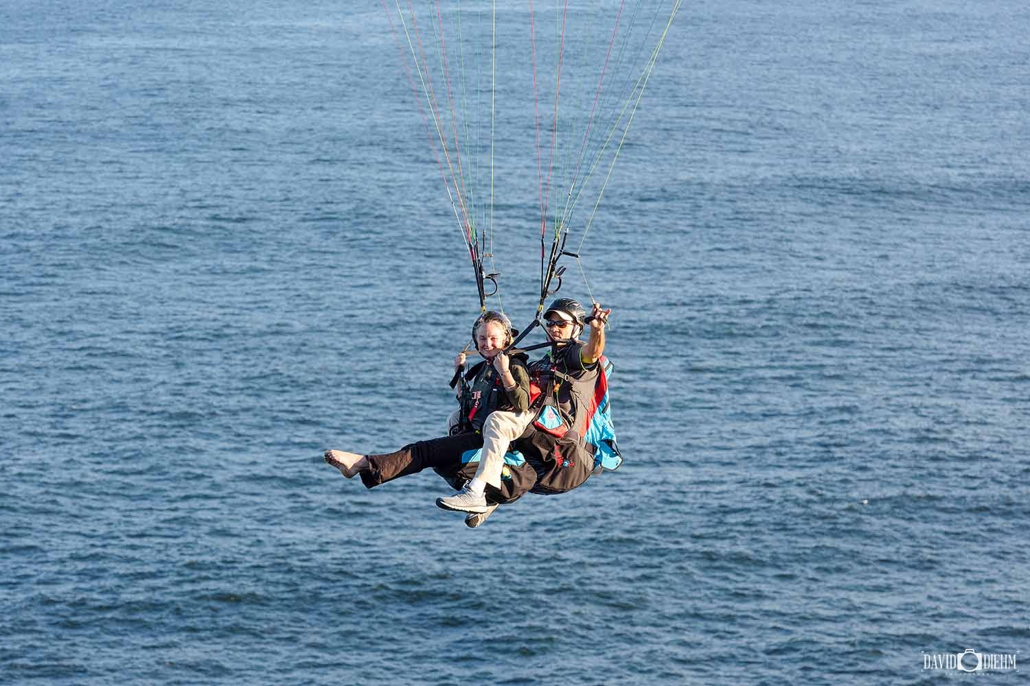 tandem-paragliding-newcastle-aerial-flight.jpg Close-up of a tandem paragliding flight above the Newcastle coastline on a clear day.