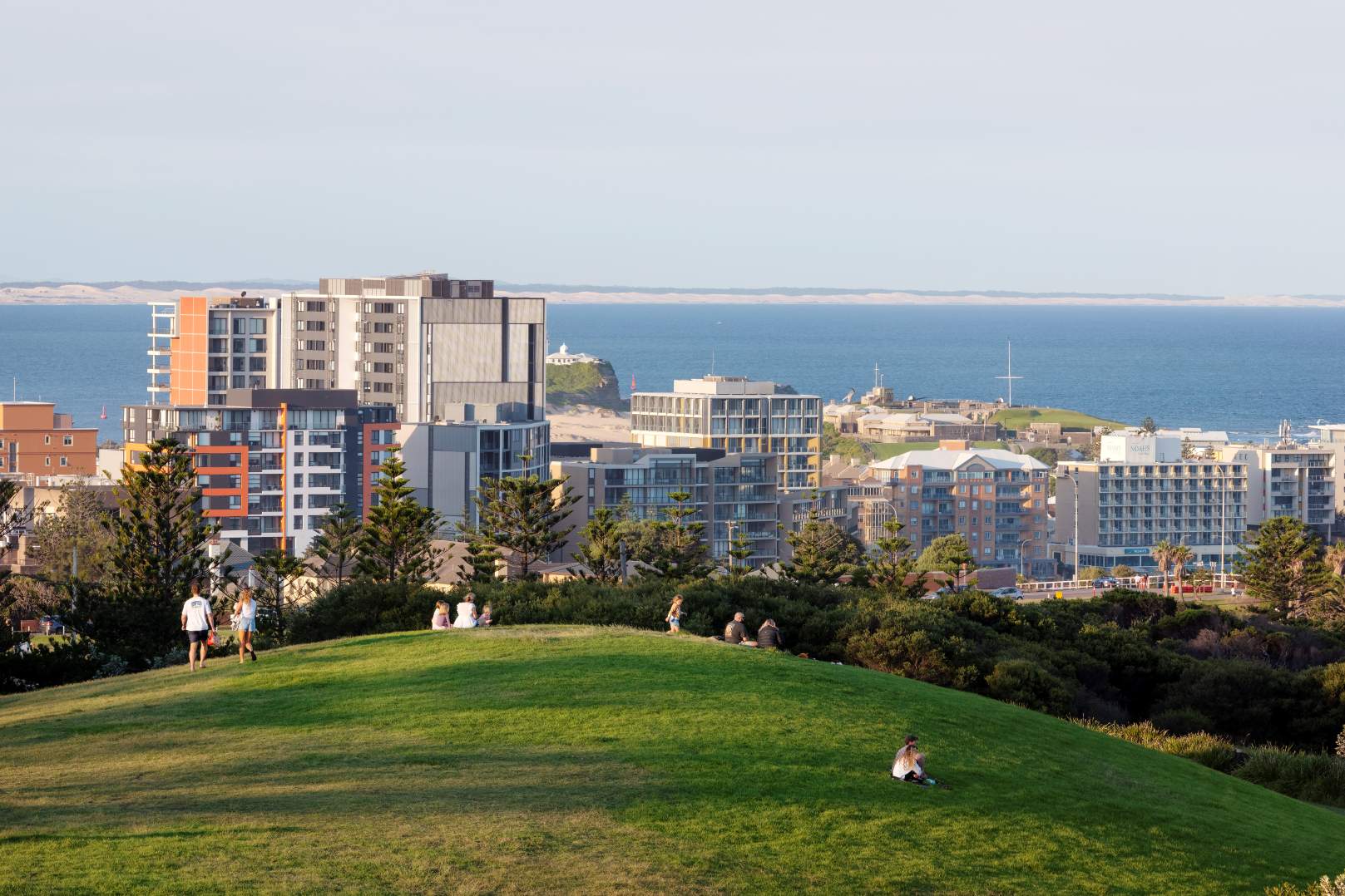 Visitors enjoying panoramic views from King Edward Park overlooking Newcastle city and coastline