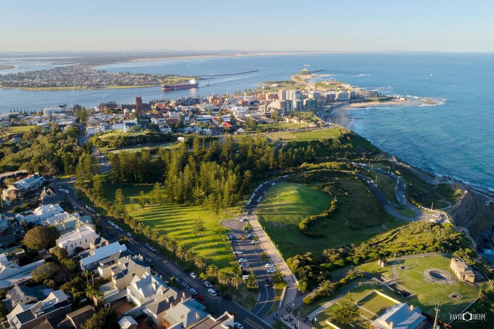 Aerial view of King Edward Park Newcastle overlooking Newcastle Harbour, Nobbys Lighthouse and the Pacific Ocean