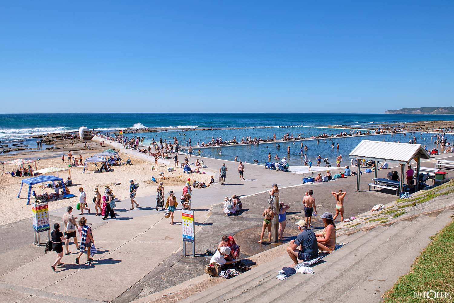 Merewether Ocean Baths Newcastle crowded with swimmers enjoying Australia's largest ocean baths on a summer day