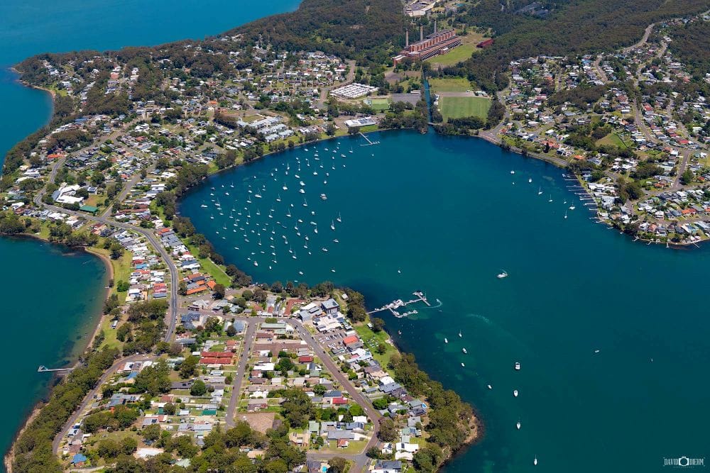 Aerial view of Wangi Wangi peninsula and sailing boats on Lake Macquarie NSW