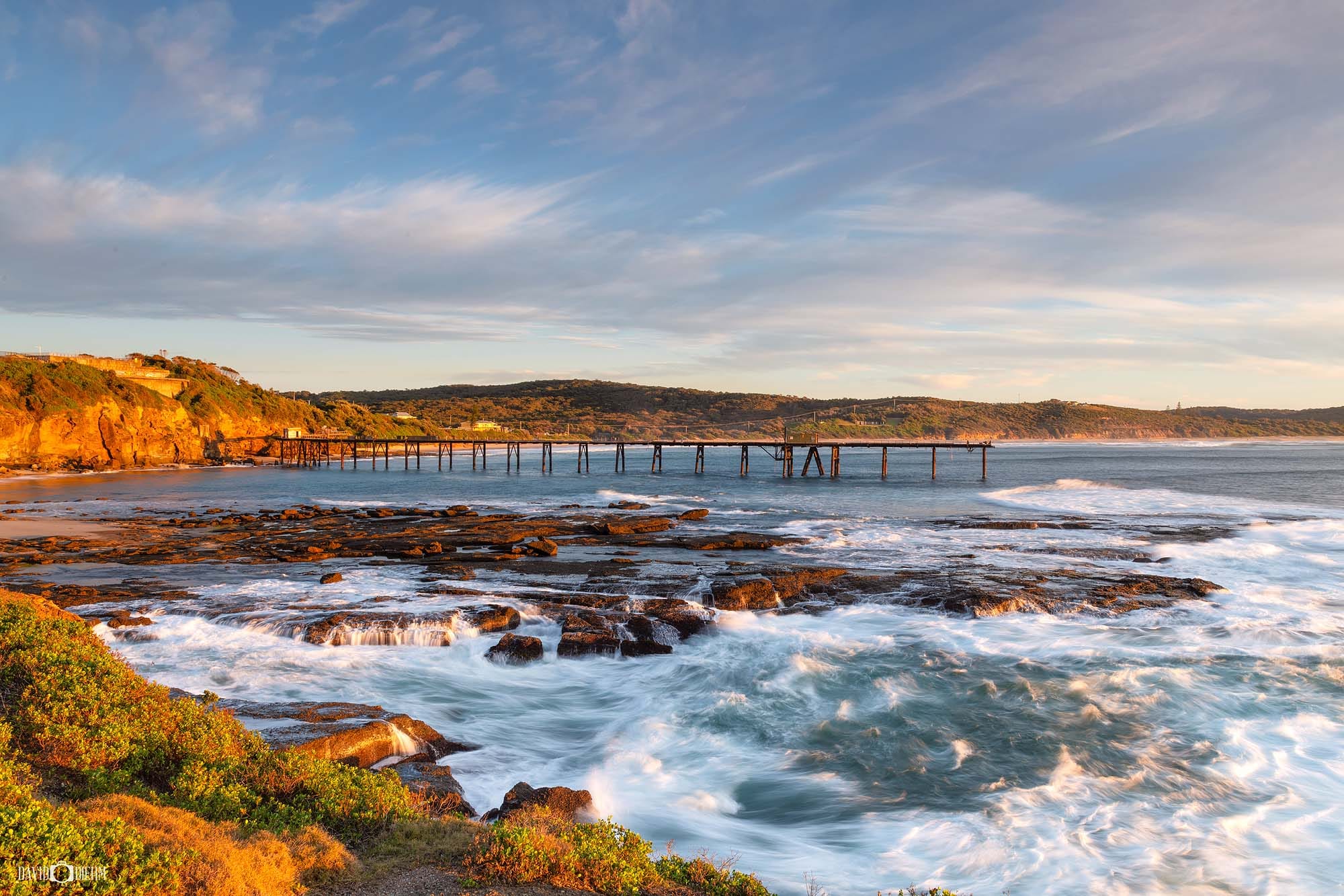 Rock platforms and historic coal-loading jetty at Catherine Hill Bay on the Lake Macquarie coastline.