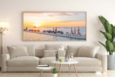 Life by the Sea wall art featuring morning activity at Merewether Ocean Baths in Newcastle NSW displayed in a modern home