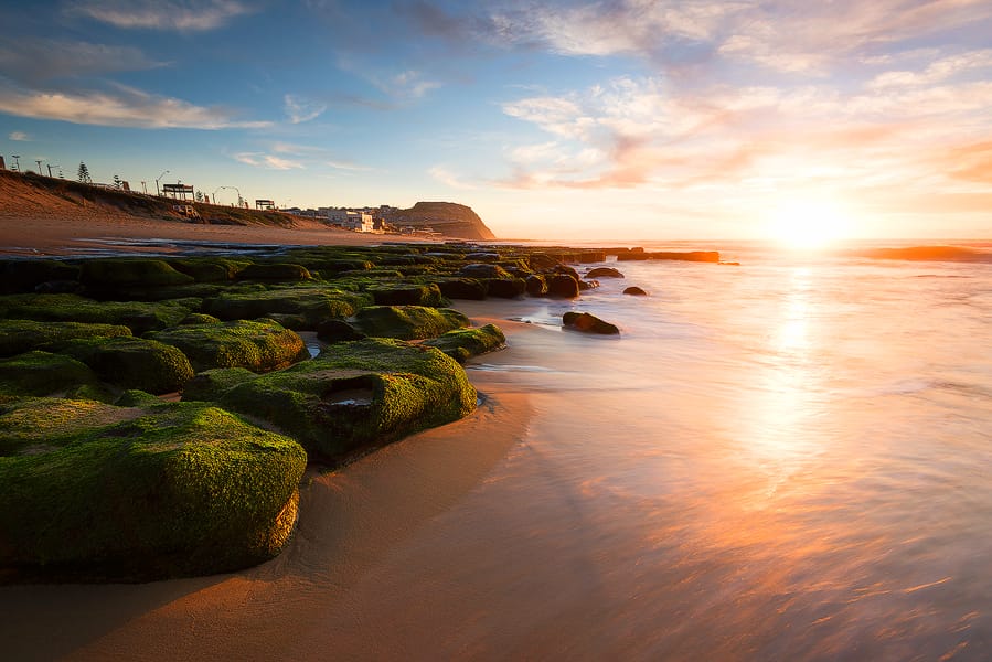 dixon-park-beach-sunrise-newcastle.jpg Sunrise light illuminating the rock platform and shoreline at Dixon Park Beach in Newcastle NSW.