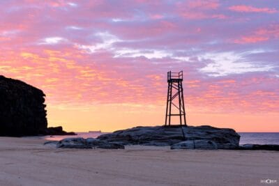 Brilliant sunrise colours lighting the sky above Redhead Beach on the NSW coastline