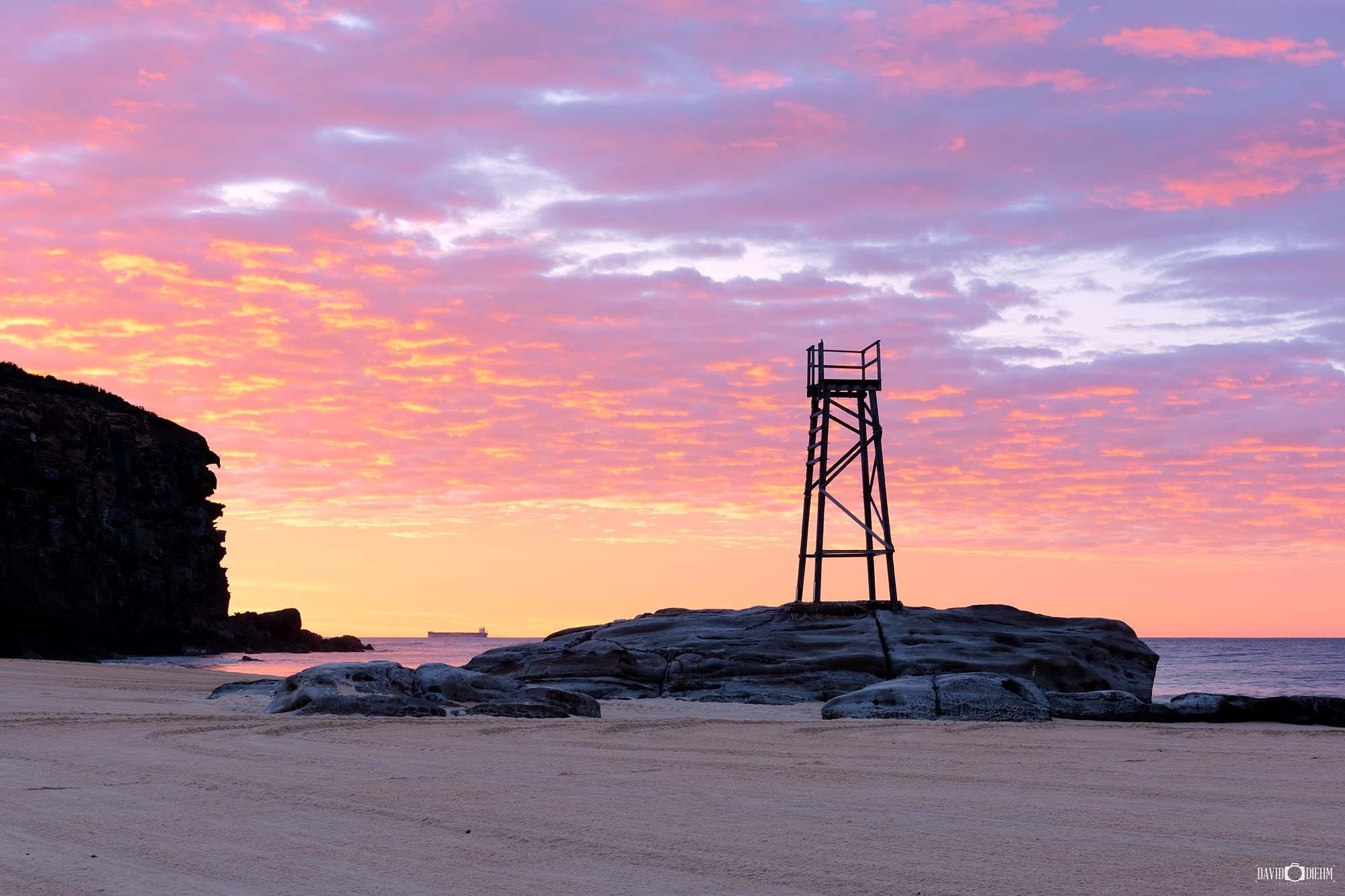 Brilliant sunrise colours lighting the sky above Redhead Beach on the NSW coastline