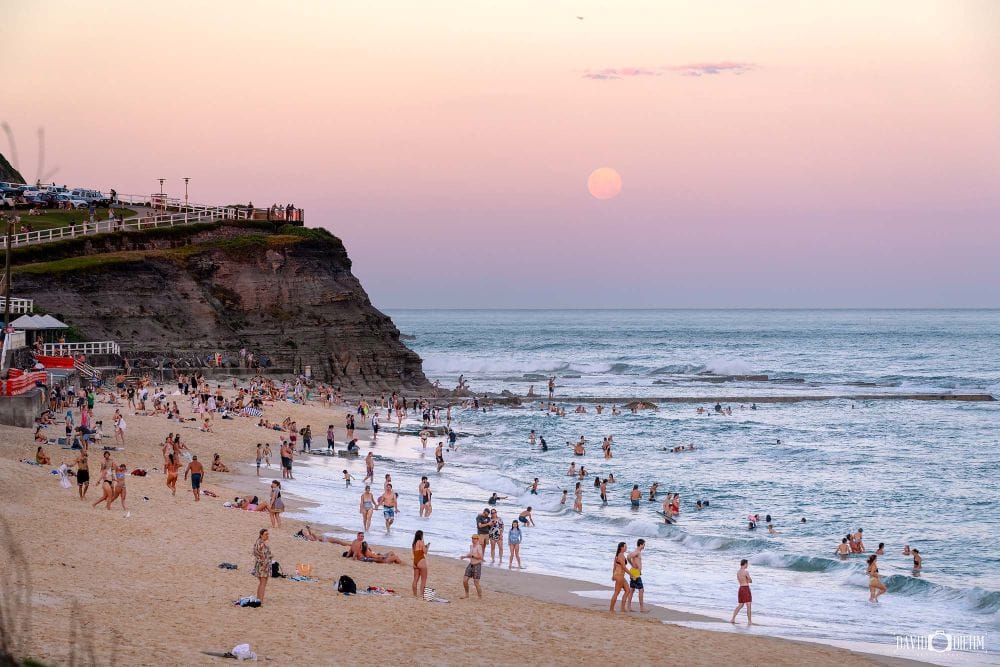 Full moon rising over Bar Beach viewed from Ronnie Watts Lookout in Newcastle NSW.