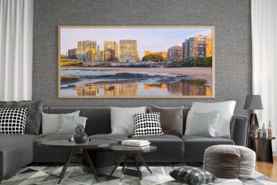 Mirror of Morning wall art featuring a panoramic sunrise reflection at Newcastle Beach displayed in a contemporary home