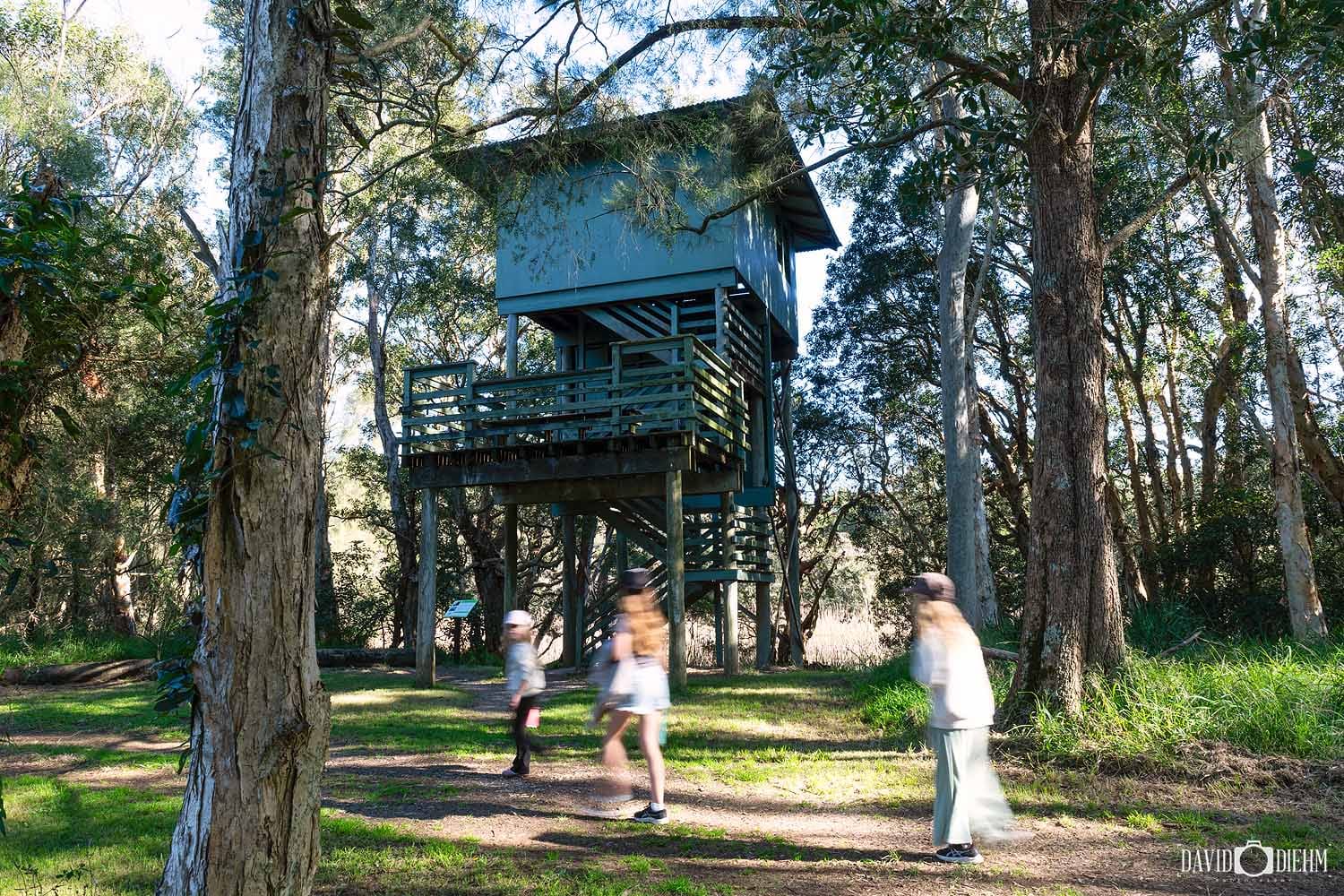 Visitors walking past the observation tower at the Hunter Wetlands Centre in Newcastle.