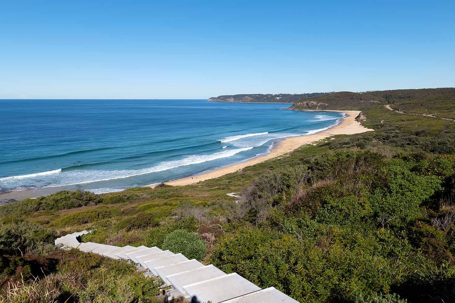 Boardwalk descending from Hickson Street Lookout towards Burwood Beach through coastal heathland in Glenrock State Conservation Area.