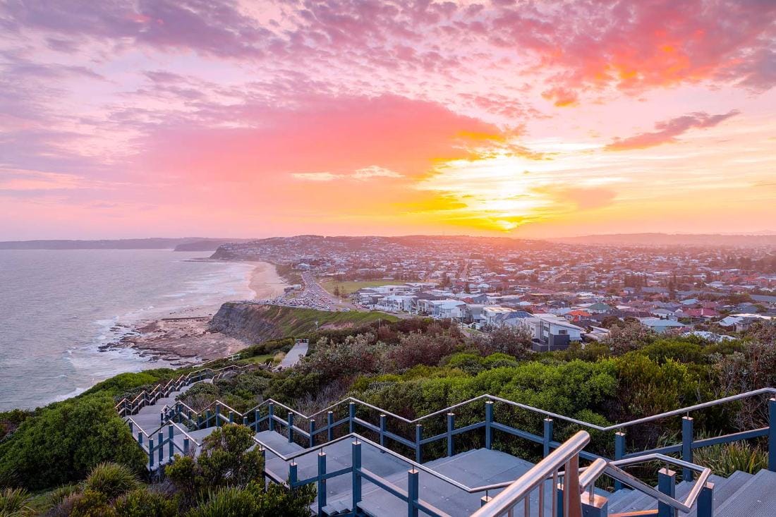 Sunset from the ANZAC Memorial Walk overlooking the Newcastle coastline and Pacific Ocean in NSW.