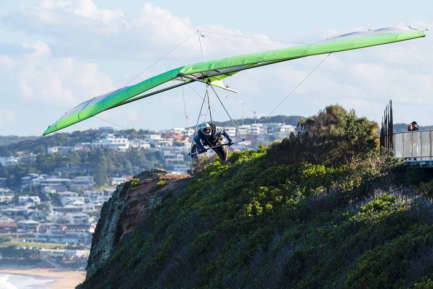 A hang glider launching from Strzelecki Lookout above Shepherds Hill in Newcastle NSW.
