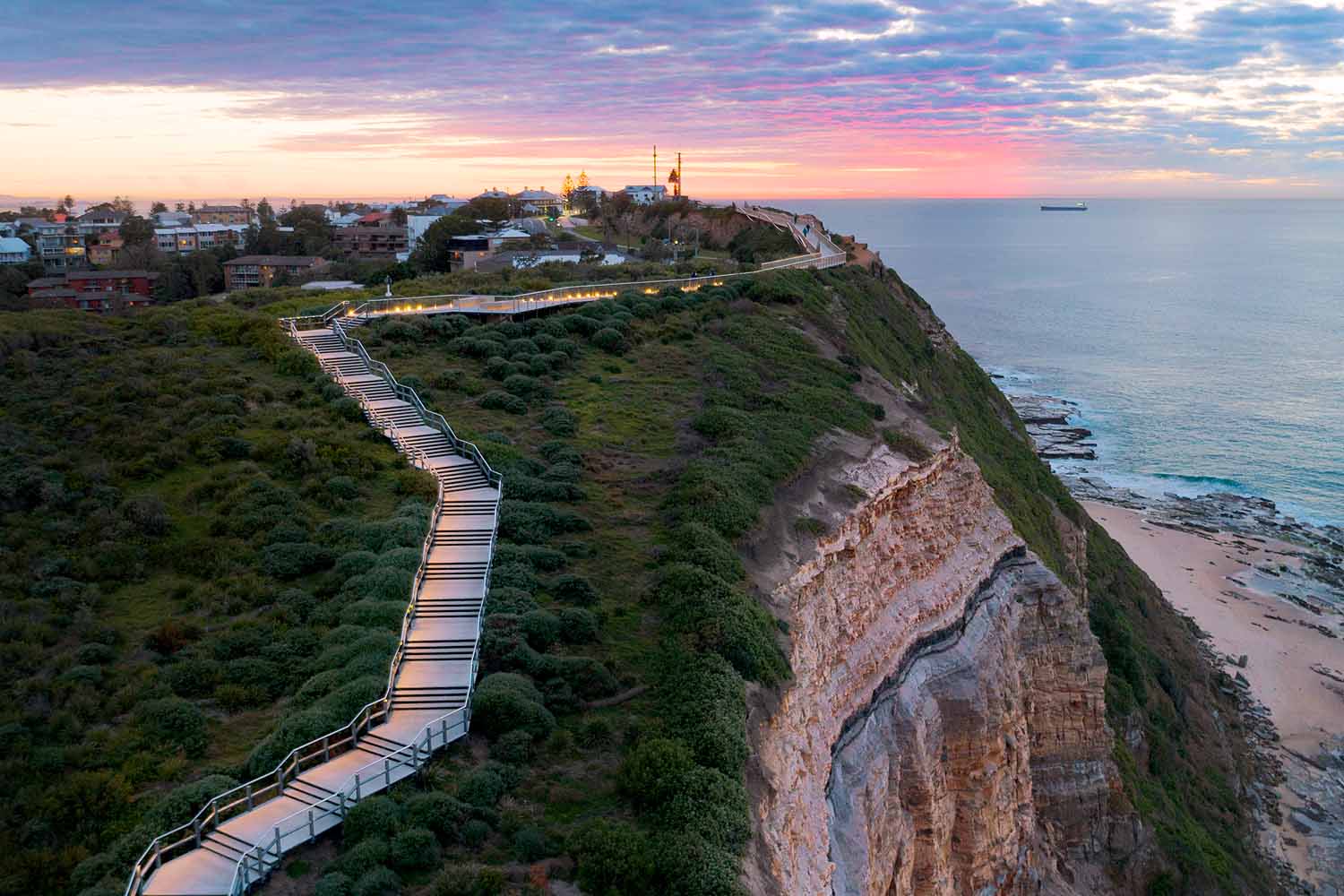 Aerial view of the ANZAC Memorial Walk, one of the best lookouts in Newcastle NSW overlooking dramatic coastal cliffs.