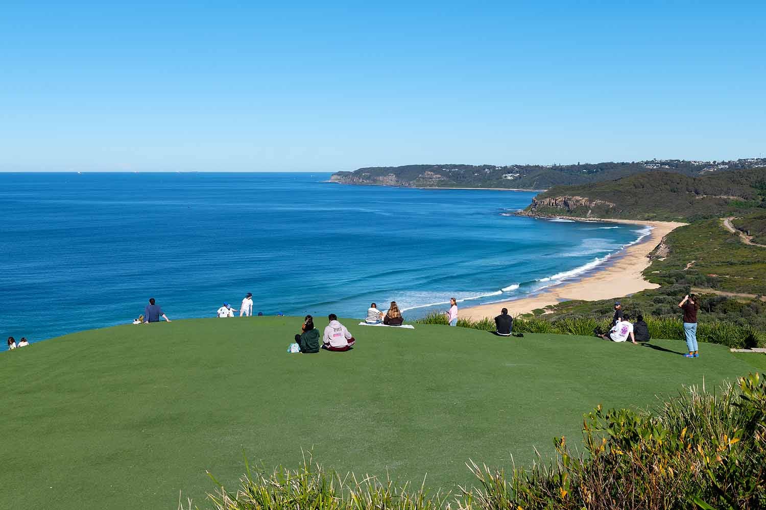 Visitors enjoying panoramic coastal views from Hickson Street Lookout overlooking Burwood Beach, Glenrock State Conservation Area and the Newcastle coastline.