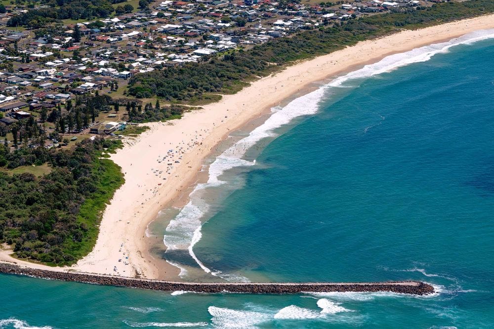 Aerial view of Blacksmiths Beach and the southern end of Nine Mile Beach in Lake Macquarie NSW.