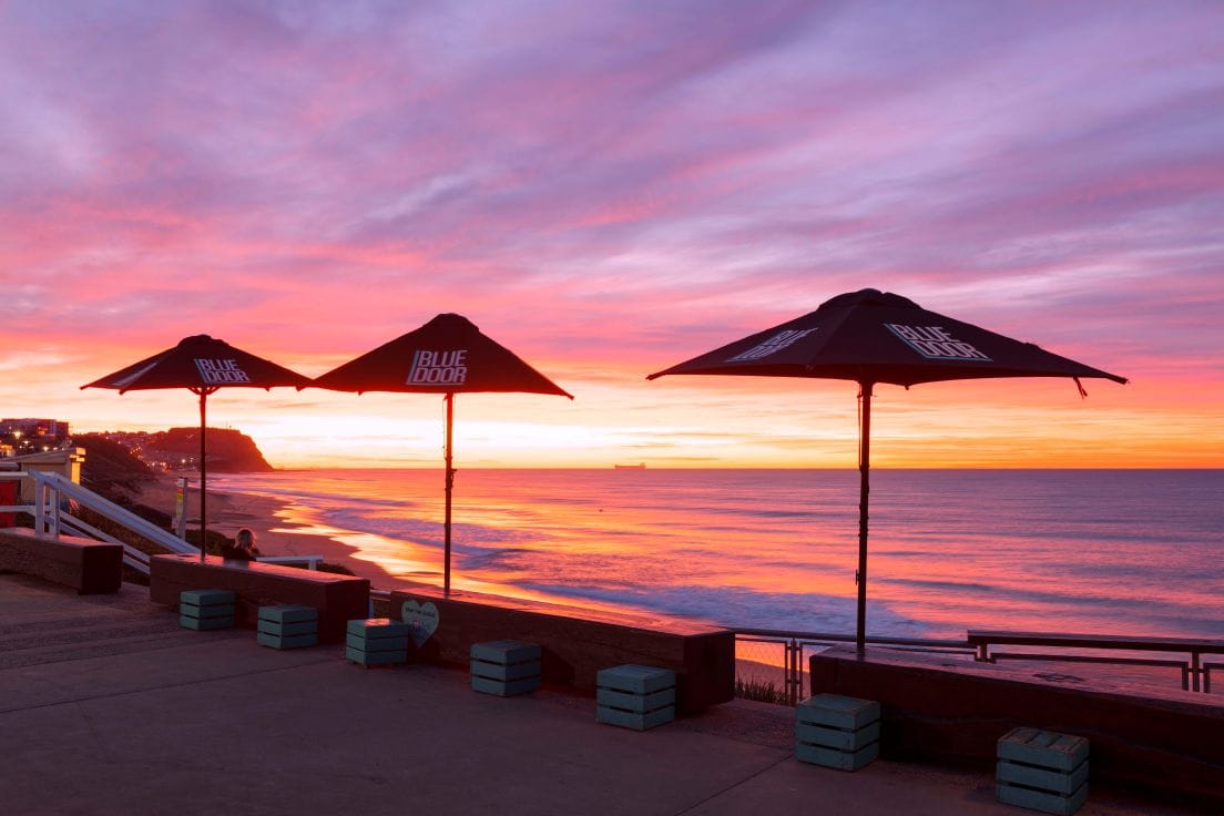merewether-beach-sunrise-cafe-newcastle.jpg Sunrise view from the Blue Door Kiosk overlooking Merewether Beach in Newcastle NSW.
