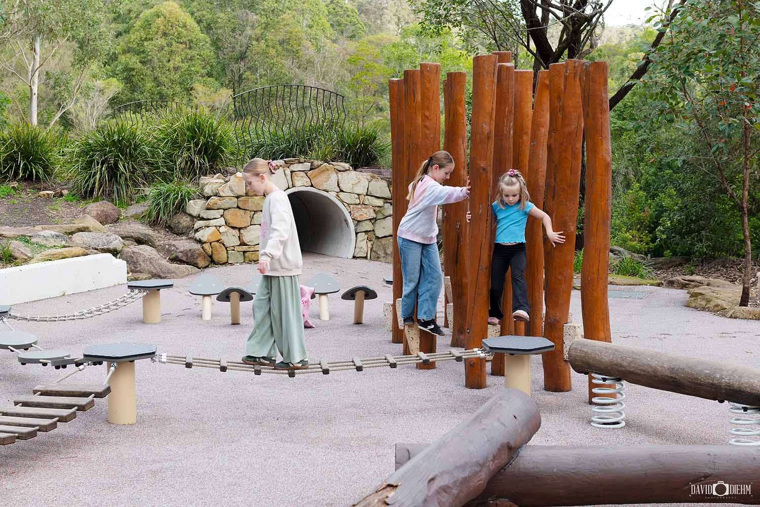 Children playing at the nature playground in Blue Gum Hills Regional Park, Minmi NSW.