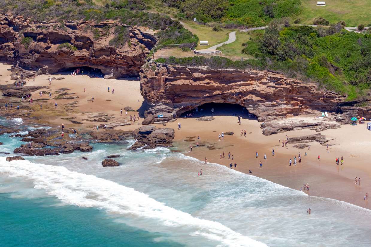 Aerial view of the famous sea caves and sandstone headland at Caves Beach in Lake Macquarie NSW.
