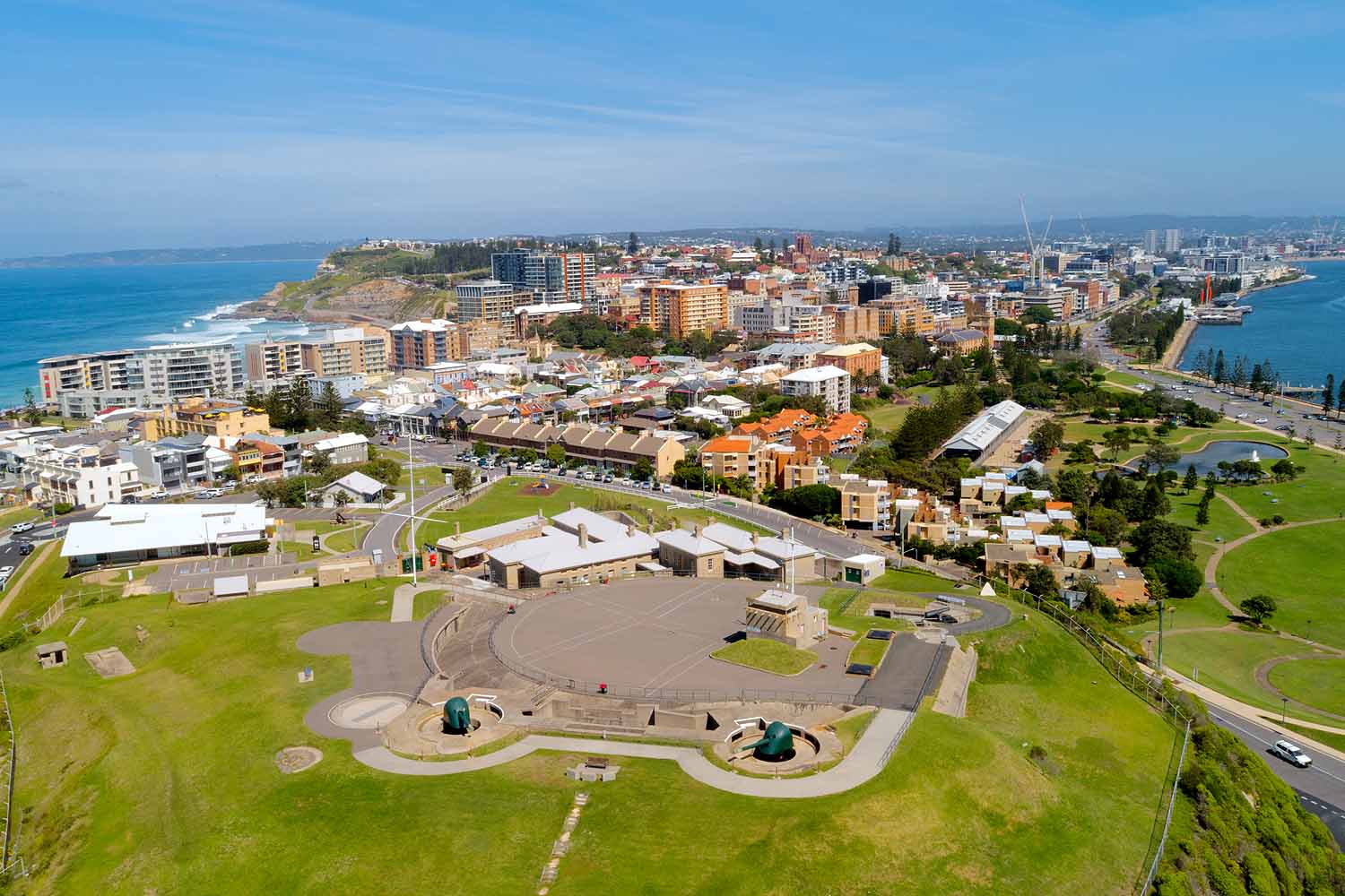 Aerial view of Fort Scratchley overlooking Newcastle Harbour, Nobbys Headland, the city skyline and the Pacific Ocean in Newcastle NSW.