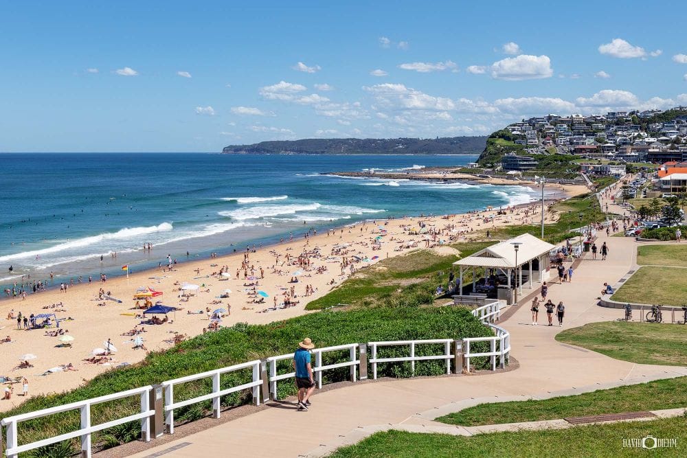 dixon-park-beach-summer-newcastle-nsw.jpg Dixon Park Beach on a busy summer day with swimmers, surfers and beachgoers enjoying Newcastle's coastline.