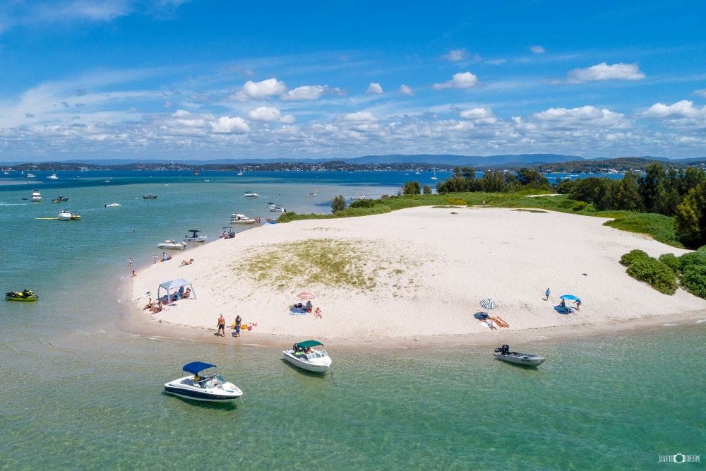 Aerial view of Elizabeth Island surrounded by turquoise waters in Lake Macquarie