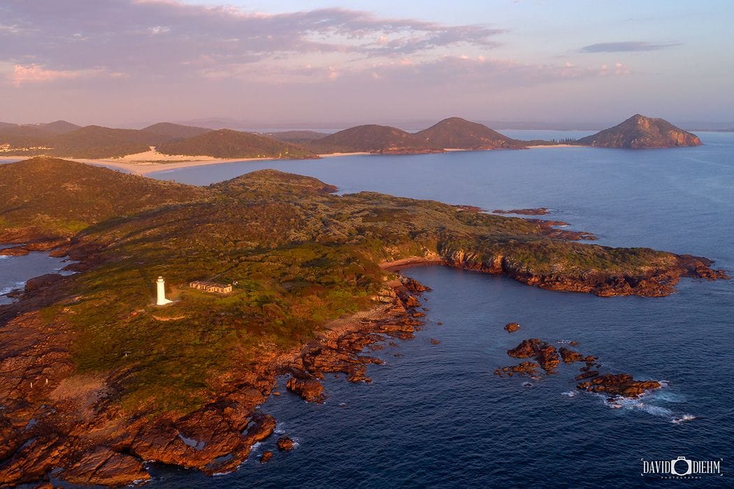 Fingal Island and Point Stephens Lighthouse viewed from Fingal Bay in Port Stephens NSW