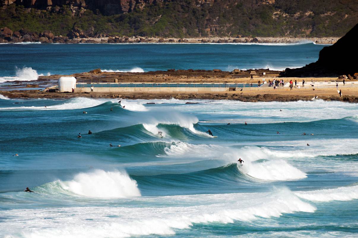 merewether-beach-surf-break-newcastle.jpg Surfers riding clean waves at Merewether Beach, Newcastle NSW, one of Australia's most famous surfing beaches.