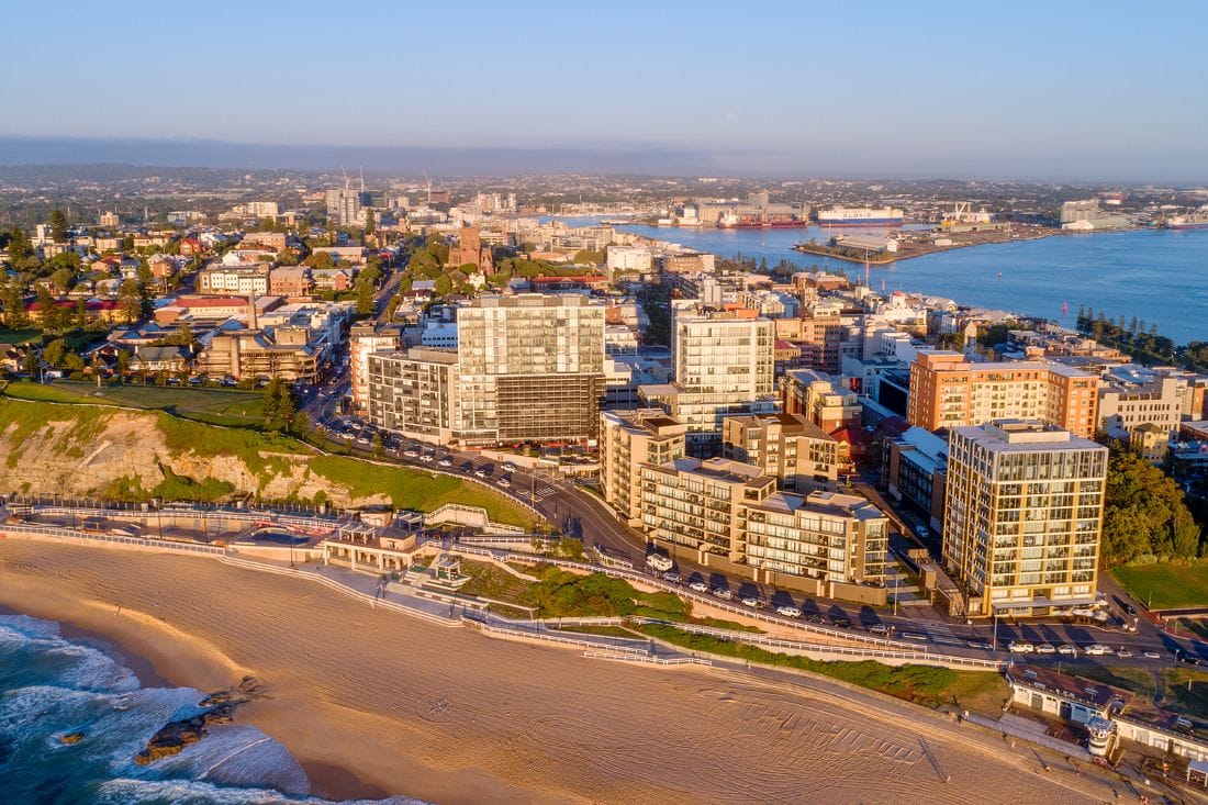 newcastle-beach-aerial-cityscape-newcastle.jpg Aerial view of Newcastle Beach, Newcastle CBD and Newcastle Harbour at sunrise in Newcastle NSW.
