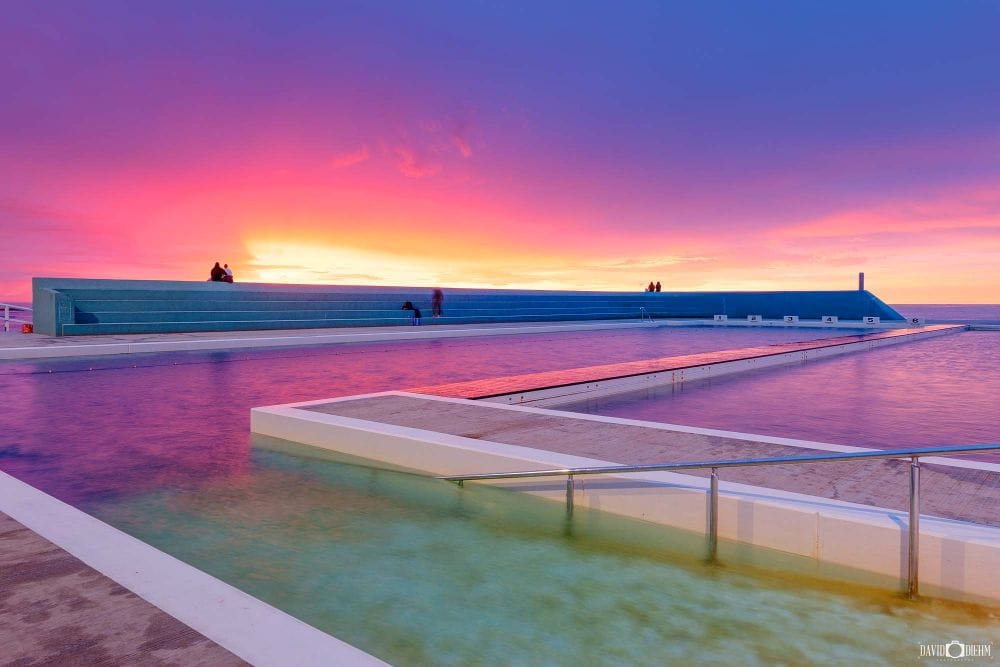 canoe-pool-sunrise-newcastle-ocean-baths.jpg Vibrant sunrise colours reflecting across Canoe Pool at Newcastle Ocean Baths, one of Newcastle's most iconic ocean swimming locations.