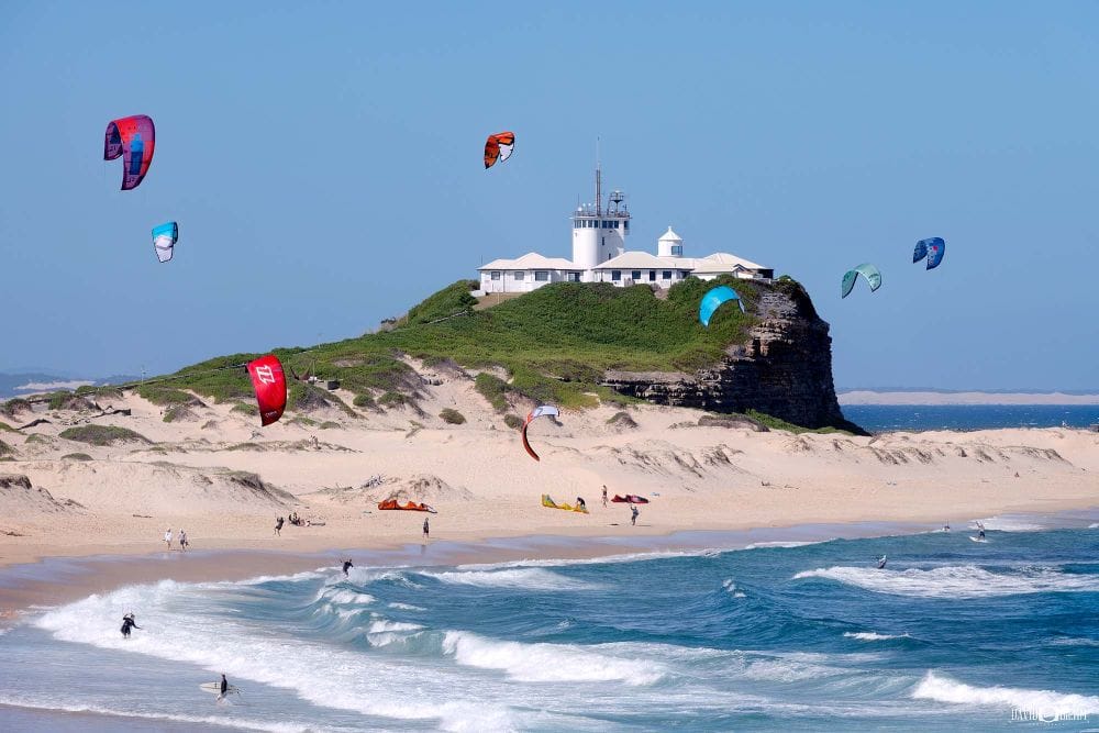 nobbys-beach-lighthouse-kitesurfers-newcastle.jpg Kitesurfers riding the afternoon sea breeze near Nobbys Lighthouse at Nobbys Beach, Newcastle NSW.