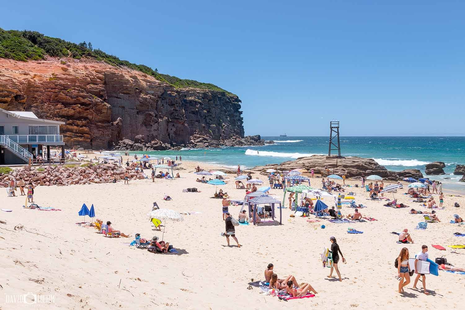 Redhead Beach with Redhead Bluff and the historic Shark Tower in Lake Macquarie, NSW.