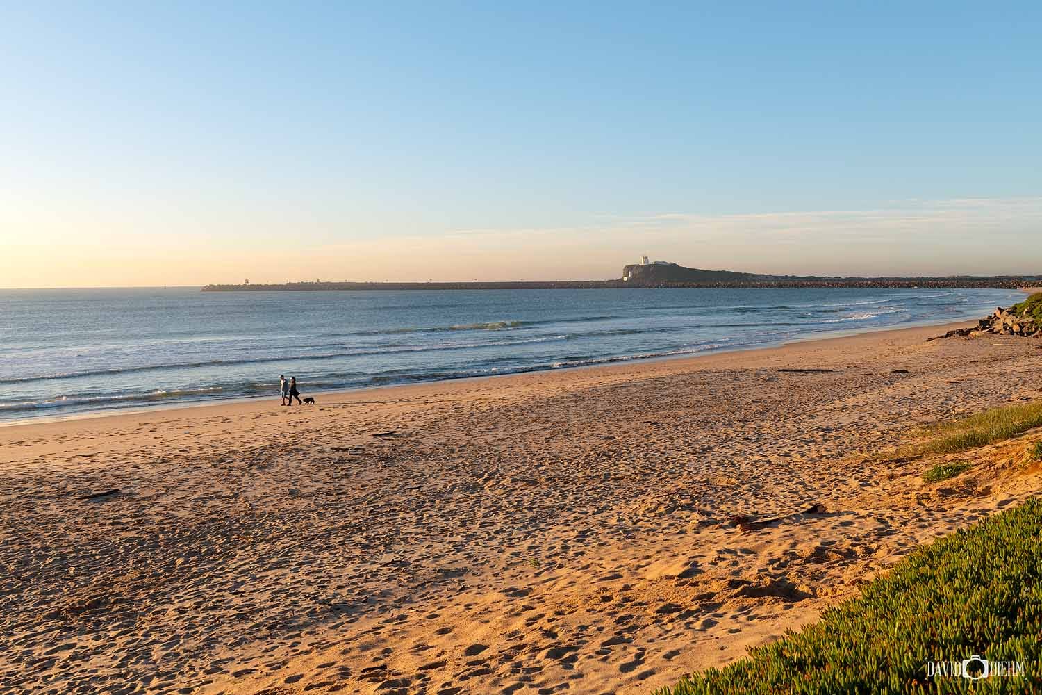 stockton-beach-morning-nobbys-lighthouse.jpg Morning light across Stockton Beach with views towards Nobbys Head Lighthouse and Newcastle Harbour.